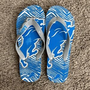 Blue and Gray Flip Flops with Lion Design